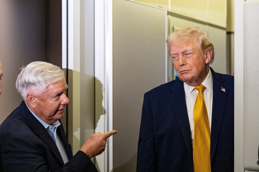 Sen. Lindsey Graham, R-S.C., left, gestures as President Donald Trump speaks with reporters while in flight on Air Force One, Jan. 4, 2026, as they were returning to Joint Base Andrews, Md. (AP Photo/Alex Brandon, File)