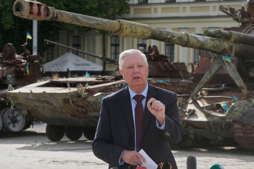 U.S. Sen. Lindsey Graham, R-S.C. answer media questions near damaged Russian tanks exhibition in central Kyiv, Friday, July 10, 2026. (AP Photo/Efrem Lukatsky)