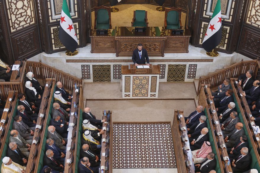 Syrian President Ahmad al-Sharaa addresses the inaugural session of Syria's newly formed People's Assembly, the first since the fall of President Bashar Assad's government, in Damascus, Syria, Sunday, July 12, 2026. (AP Photo/Ghaith Alsayed)