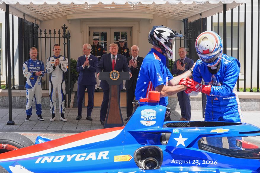 IndyCar Series driver David Malukas, right, exits a race car following a demonstration as Felix Rosenqvist, the 2026 Indy 500 winner, from left, Alex Palou, the reigning IndyCar champion, Bud Denker, Freedom 250 Grand Prix chair and Penske Corp. president, President Donald Trump, Roger Penske, chairperson and founder of Penske Corp., and Fox Sports CEO Eric Shanks watch on West Executive Drive at the White House during a showcase for the upcoming Freedom 250 Grand Prix auto race, Monday, July 13, 2026, in Washington. (AP Photo/Alex Brandon)