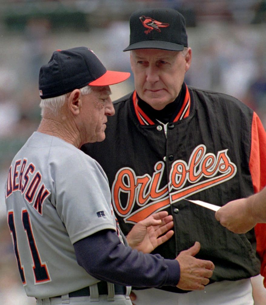Detroit Tigers manager Sparky Anderson, left, and Baltimore Orioles manager Phil Regan chat at home plate together with umpire Ken Kaiser prior to the start of the final game of the regular season Sunday, Oct. 1, 1995 at Camden Yards in Baltimore. (AP Photo/Roberto Borea)
