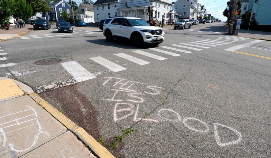 Blood is seen on the pavement near the scene of a shooting involving U.S. Immigration and Customs Enforcement, Monday, July 13, 2026 in Biddeford, Maine. (AP Photo/Robert F. Bukaty)