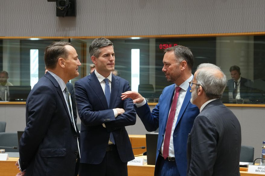 From left, Poland's Foreign Minister Radoslaw Sikorski, Netherland's Foreign Minister Tom Berendsen, Belgium's Foreign Minister Maxime Prevot and Portugal's Foreign Minister Paulo Rangel during a round table meeting of EU foreign ministers in Brussels, Monday, July 13, 2026. (AP Photo/Marius Burgelman)
