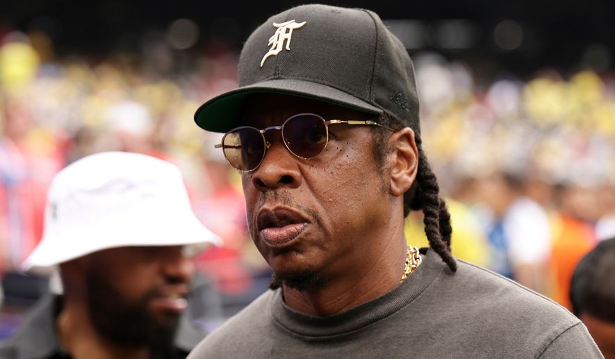 Jay-Z looks on ahead of the start the World Cup round of 16 soccer match between Brazil and Norway in East Rutherford, N.J., near New York, Sunday, July 5, 2026. (AP Photo/Adam Hunger)