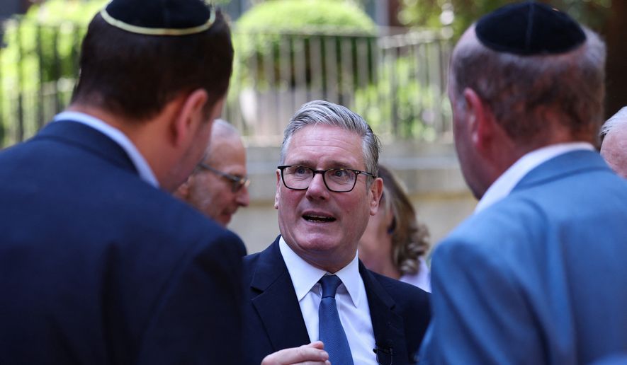 Britain's Prime Minister Keir Starmer, center, hosts a reception with the Jewish community, to discuss efforts to tackle antisemitism, at Downing Street in London, England, Monday, July 13, 2026. (Suzanne Plunkett/Pool Photo via AP)