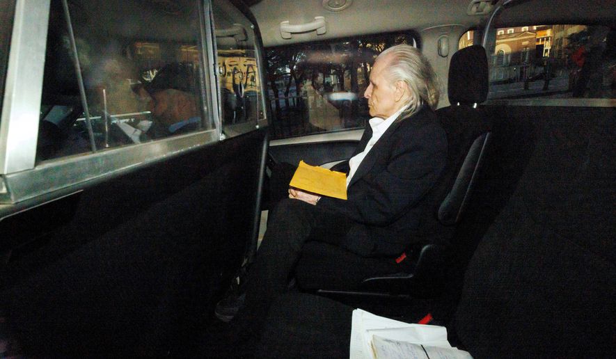 Former fashion executive Peter Nygard, seen through a police vehicle window, arrives at a courthouse in Toronto, Oct. 3, 2023. (Cole Burston/The Canadian Press via AP, File)
