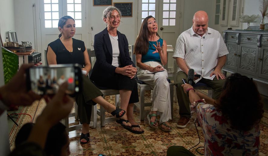From left, U.S. Representatives Delia C. Ramirez of Illinois, Maxine Dexter of Oregon, Teresa Leger Fernández of New Mexico and Mark Pocan of Wisconsin, all Democrats, hold a news conference in Havana, Cuba, Sunday, July 12, 2026. (AP Photo/Ramon Espinosa)