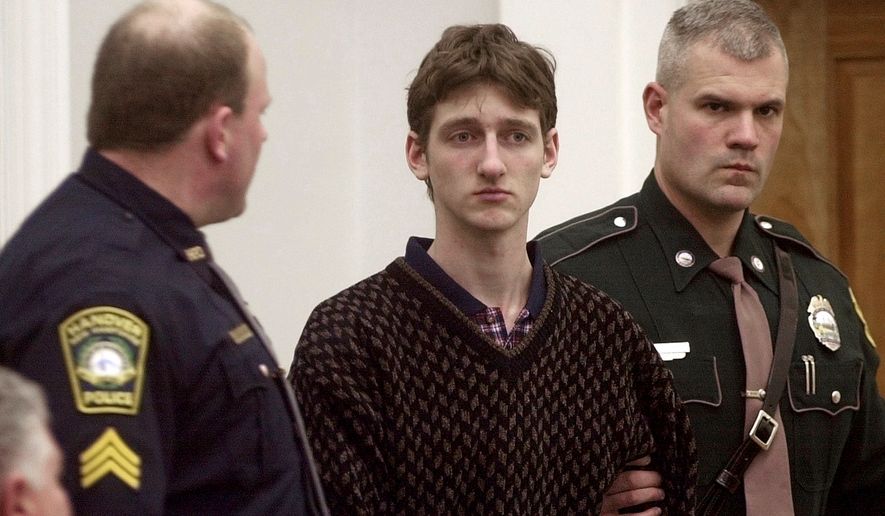 FILE - Robert Tulloch, 17, is escorted into Lebanon, N.H. District Court by Tropper James Stienmetz, right, and Hanover Sgt. Jeffrey Fleury, Feb. 21, 2001. (AP Photo/Jim Cole, File)