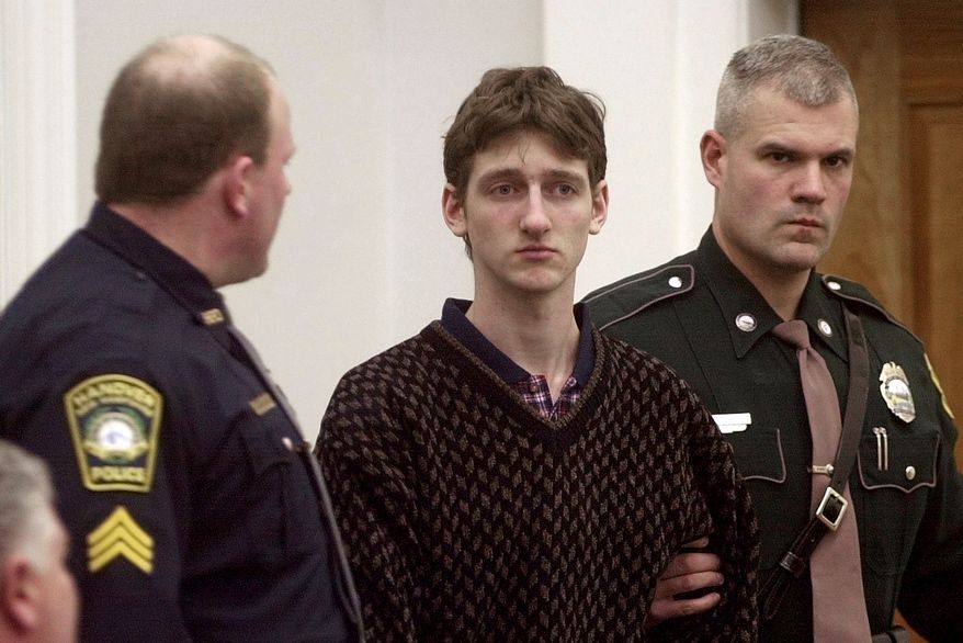 FILE - Robert Tulloch, 17, is escorted into Lebanon, N.H. District Court by Tropper James Stienmetz, right, and Hanover Sgt. Jeffrey Fleury, Feb. 21, 2001. (AP Photo/Jim Cole, File)