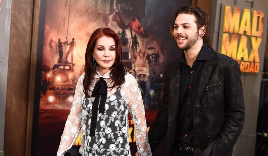 Priscilla Presley and her son, Navarone Garibaldi arrive at the Los Angeles premiere of "Mad Max: Fury Road" at the TCL Chinese Theatre on Thursday, May 7, 2015. (Photo by Jordan Strauss/Invision/AP) ** FILE **