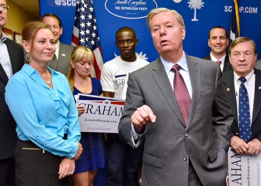 Republican presidential candidate and Sen. Lindsey Graham, R-S.C., accompanied by his sister Darline, left, speaks Sept. 1, 2015, at the GOP headquarters in Columbia, S.C., where he filed for the South Carolina presidential primary. (AP Photo/Richard Shiro) **FILE**