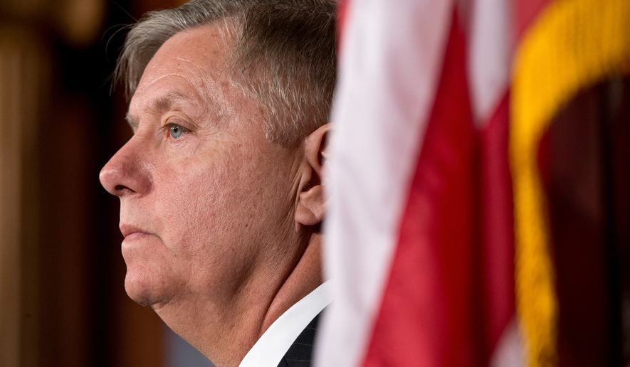 Sen. Lindsey Graham, R-S.C., listens during a Capitol Hill news conference in Washington, March 6, 2013. (AP Photo/J. Scott Applewhite, File)