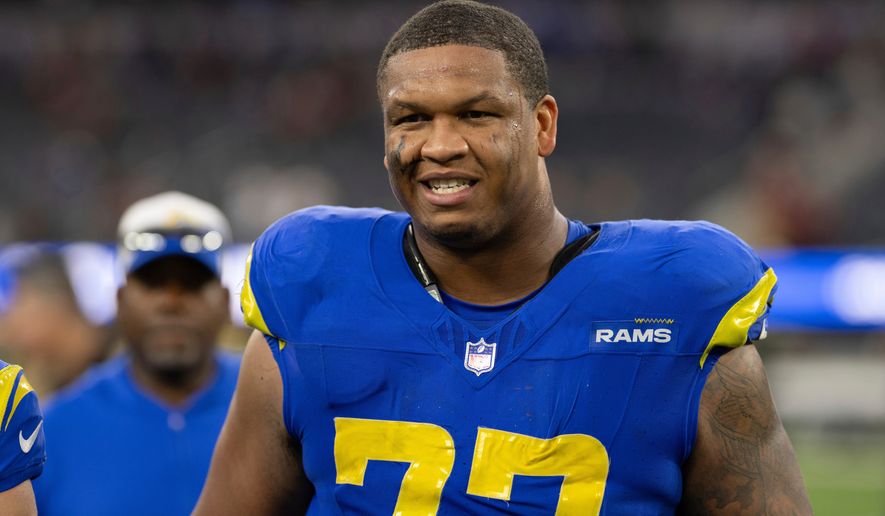 FILE - Los Angeles Rams offensive tackle Alaric Jackson (77) walks back to the locker room after an NFL football game against the Washington Commanders, Dec. 17, 2023, in Inglewood, Calif. (AP Photo/Kyusung Gong, File)