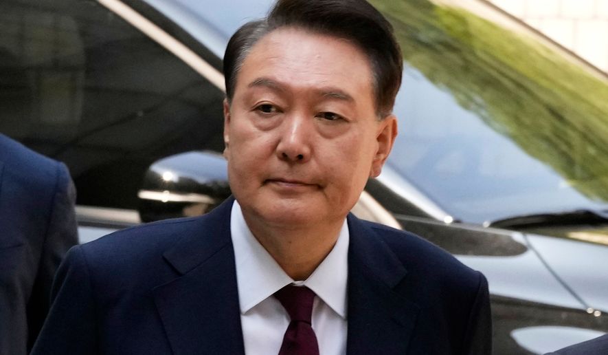 South Korea's ousted former President Yoon Suk Yeol arrives to attend his trial at the Seoul Central District Court in Seoul, South Korea, May 12, 2025. (AP Photo/Ahn Young-joon, Pool, File)