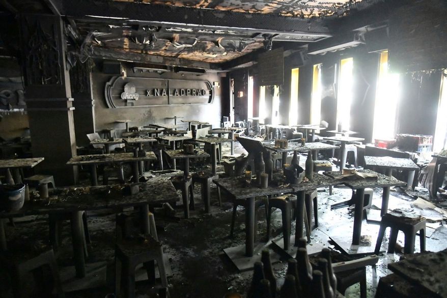 In this handout photo released by Bangkok Metropolitan Administration, the interior of a beer bar is seen after a fire in Bangkok, Thailand, Monday, July 13, 2026. (Bangkok Metropolitan Administration via AP)