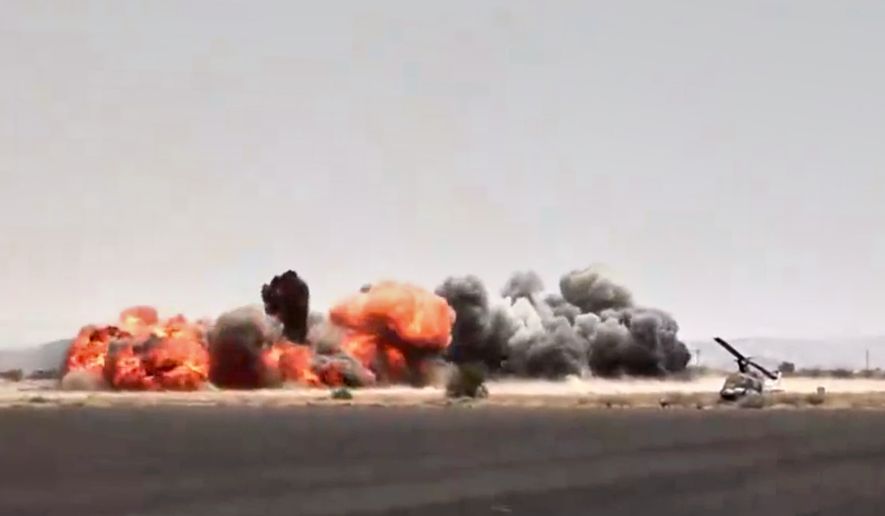 This image taken from video broadcast by Al-Masirah TV, a Houthi-controlled news channel, shows an explosion at the Sanaa International Airport compound during what the Iranian-backed Houthi rebels in Yemen said were several Saudi airstrikes in Sanaa, Yemen, Monday, July 13, 2026. (Al-Masirah TV via AP)