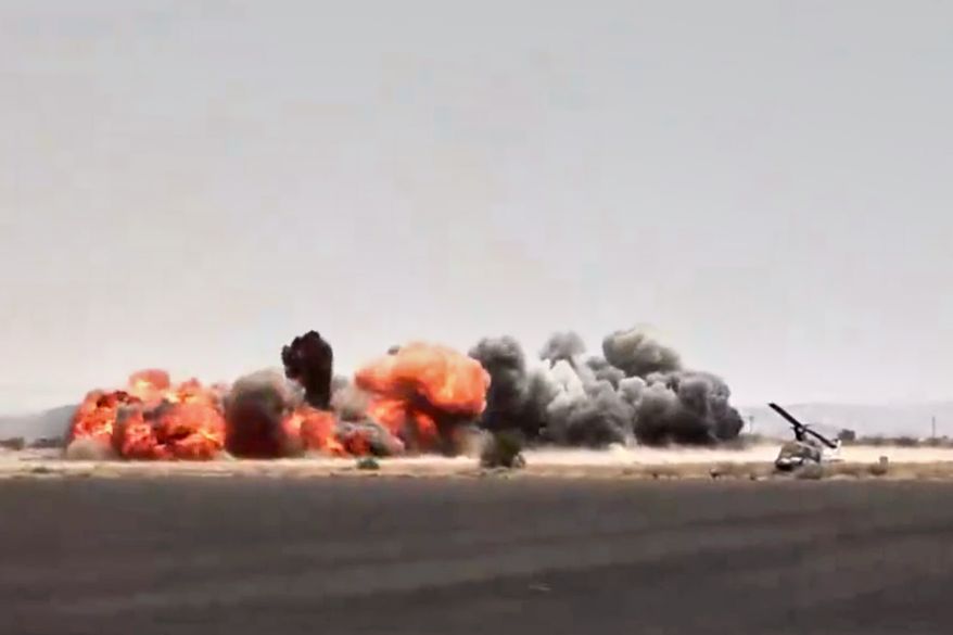 This image taken from video broadcast by Al-Masirah TV, a Houthi-controlled news channel, shows an explosion at the Sanaa International Airport compound during what the Iranian-backed Houthi rebels in Yemen said were several Saudi airstrikes in Sanaa, Yemen, Monday, July 13, 2026. (Al-Masirah TV via AP)