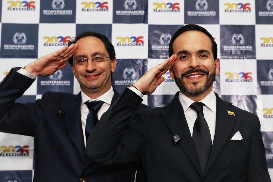 Independent presidential candidate Abelardo de la Espriella, right, and his running mate Jose Manuel Restrepo salute as they present their ticket in Cali, Colombia, Thursday, March 12, 2026. (AP Photo/Santiago Saldarriaga)