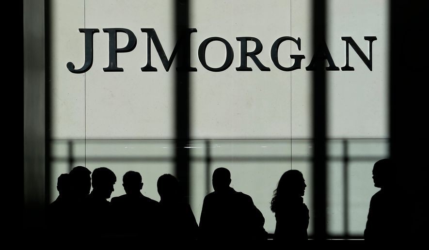 FILE - In this Monday, Oct. 21, 2013, file photo, the JPMorgan Chase & Co. logo is displayed at their headquarters in New York. (AP Photo/Seth Wenig, File)