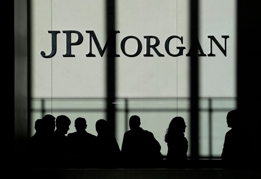 FILE - In this Monday, Oct. 21, 2013, file photo, the JPMorgan Chase & Co. logo is displayed at their headquarters in New York. (AP Photo/Seth Wenig, File)