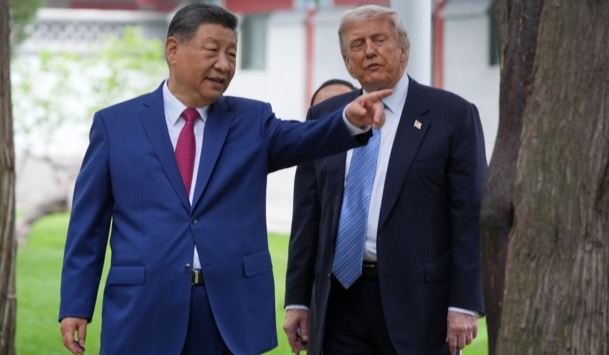 President Donald Trump talks with China's President Xi Jinping at the Zhongnanhai leadership compound, May 15, 2026, in Beijing. (AP Photo/Mark Schiefelbein, Pool, File)