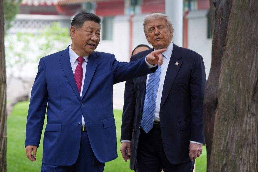 President Donald Trump talks with China's President Xi Jinping at the Zhongnanhai leadership compound, May 15, 2026, in Beijing. (AP Photo/Mark Schiefelbein, Pool, File)