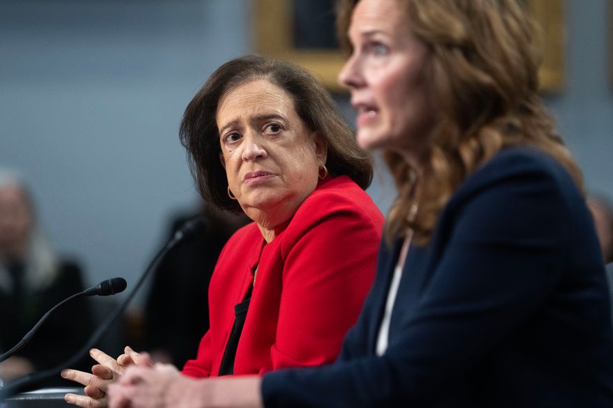 Supreme Court Justices Amy Coney Barrett, right, and Elena Kagan testify during a House Appropriations subcommittee hearing, Tuesday, July 14, 2026, on Capitol Hill in Washington. (AP Photo/Nathan Howard)