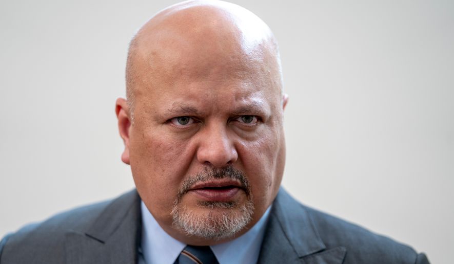 FILE - Karim Khan, Prosecutor of the International Criminal Court, looks up prior to a press conference in The Hague, Netherlands, July 3, 2023. (AP Photo/Peter Dejong, File)