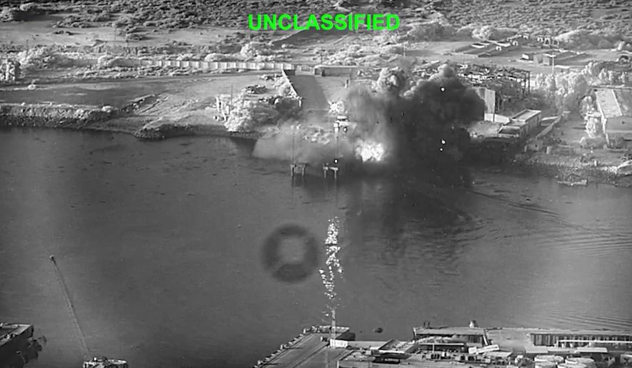 This image from video released by U.S. Central Command, shows an explosion at Bandar Abbas Naval Base, Iran, as three Corsair unmanned surface vessels, also called one-way attack surface drones, fired by the U.S. military, hit the port July 12, 2026. (U.S. Central Command via AP)