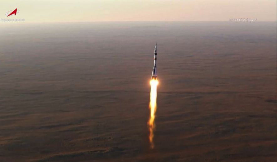 In this photo taken from video released by Roscosmos space corporation, the Soyuz-2.1 rocket booster with Soyuz MS-29 space ship carrying NASA astronaut Anil Menon, Roscosmos cosmonauts Pyotr Dubrov and Anna Kikina, a new crew to the International Space Station, ISS, blasts off in Russian leased Baikonur cosmodrome, Kazakhstan, Tuesday, July 14, 2026. (Roscosmos space corporation, via AP)