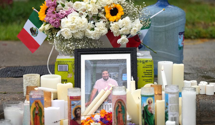 A memorial grows at the site where Lorenzo Salgado Araujo was fatally shot by ICE agents, last week, on Monday, July 13, 2026, in Houston. (AP Photo/Karen Warren)