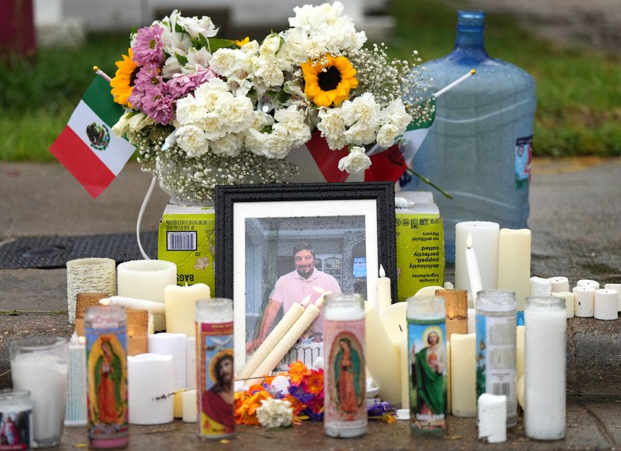 A memorial grows at the site where Lorenzo Salgado Araujo was fatally shot by ICE agents, last week, on Monday, July 13, 2026, in Houston. (AP Photo/Karen Warren)