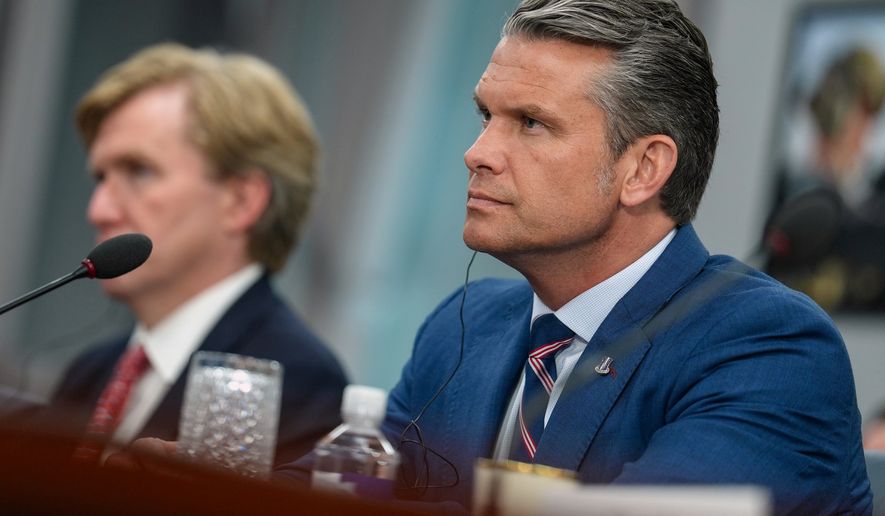 Defense Secretary Pete Hegseth listens during a meeting with Iraq's Prime Minister Ali al-Zaidi at the Pentagon Tuesday, July 14, 2026, in Washington. (Al Drago/Pool via AP)