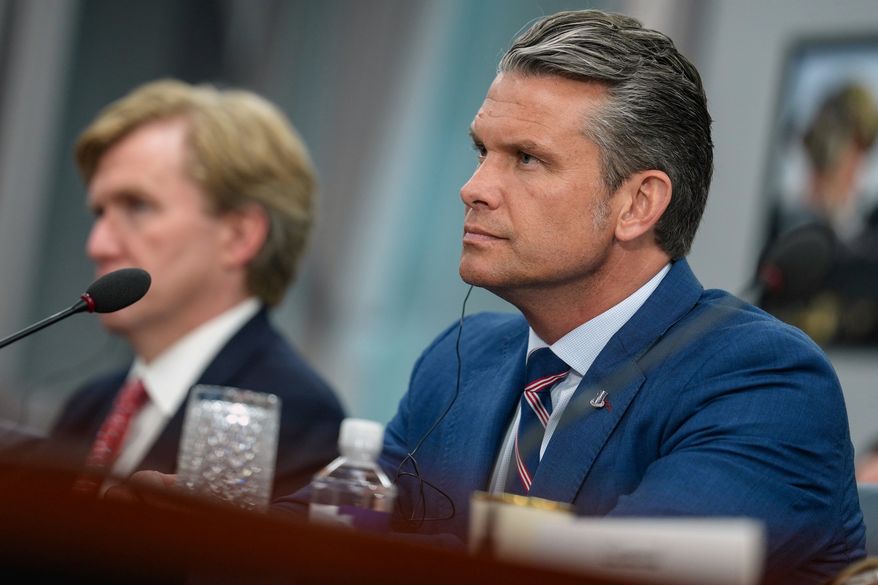 Defense Secretary Pete Hegseth listens during a meeting with Iraq's Prime Minister Ali al-Zaidi at the Pentagon Tuesday, July 14, 2026, in Washington. (Al Drago/Pool via AP)