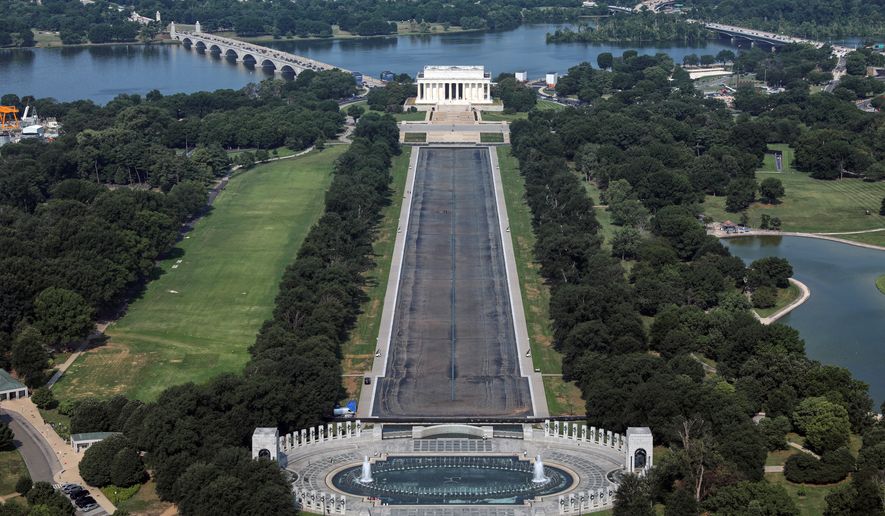 The Lincoln Memorial and the Reflecting Pool are seen from the Washington Monument, Wednesday, July 15, 2026, in Washington. (AP Photo/Rahmat Gul)