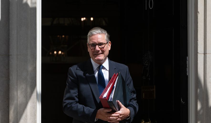 Britain's Prime Minister Keir Starmer leaves 10 Downing Street to attend Prime Minister's Questions at the House of Commons in London, Wednesday, July 15, 2026. (AP Photo/Thomas Krych)