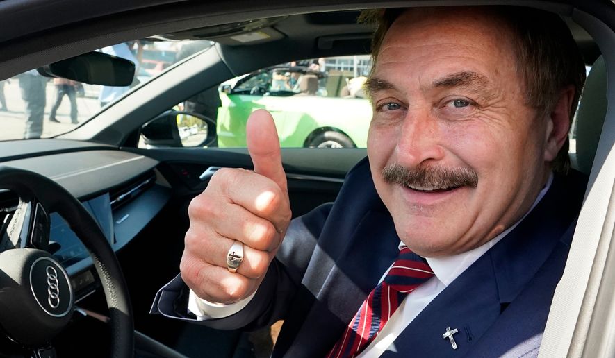 FILE - Mike Lindell gives a thumbs up as he passes by a rally for supporters of former President Donald Trump, April 4, 2023, in West Palm Beach, Fla. (AP Photo/Wilfredo Lee, File)