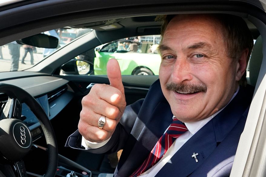 FILE - Mike Lindell gives a thumbs up as he passes by a rally for supporters of former President Donald Trump, April 4, 2023, in West Palm Beach, Fla. (AP Photo/Wilfredo Lee, File)