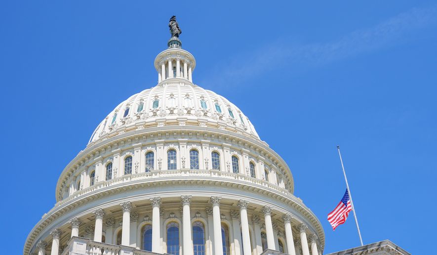 The American flag flies at half staff at the Capitol in Washington, Monday, July 13, 2026, after the sudden death of Rep. Lindsey Graham, R-S.C. (AP Photo/Mariam Zuhaib)