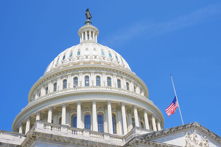 The American flag flies at half staff at the Capitol in Washington, Monday, July 13, 2026, after the sudden death of Rep. Lindsey Graham, R-S.C. (AP Photo/Mariam Zuhaib)