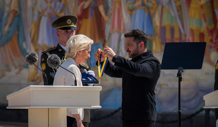 Ukrainian President Volodymyr Zelenskyy, right, awards European Commission President Ursula von der Leyen in Kyiv, Ukraine, Wednesday, July 15, 2026. (AP Photo/Dan Bashakov) ** FILE **