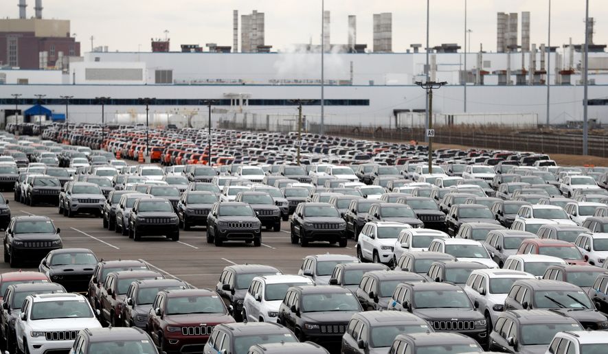 In this Feb. 26, 2019, file photo, Jeep vehicles are parked outside the Jefferson North Assembly Plant in Detroit. (AP Photo/Carlos Osorio, File)