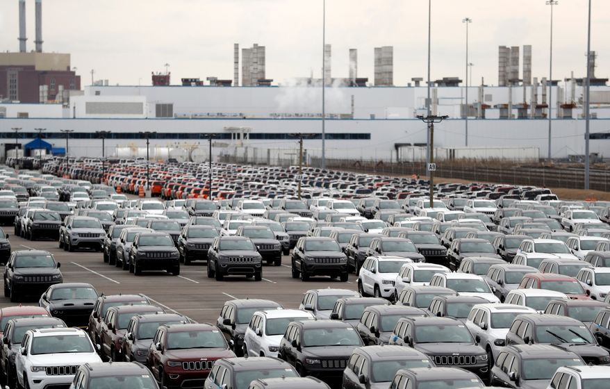 In this Feb. 26, 2019, file photo, Jeep vehicles are parked outside the Jefferson North Assembly Plant in Detroit. (AP Photo/Carlos Osorio, File)