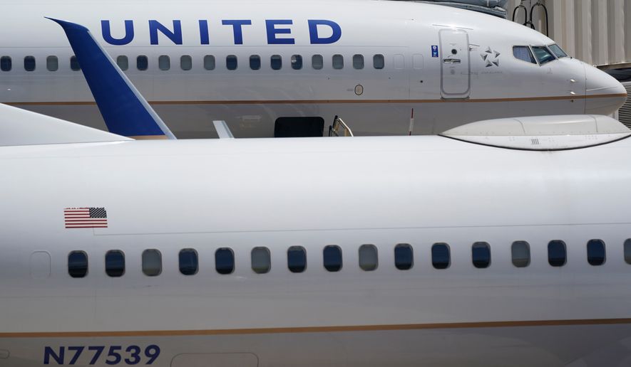 FILE - Two United Airlines Boeing 737s are shown parked at the gate, July 7, 2022, at the Fort Lauderdale-Hollywood International Airport in Fort Lauderdale, Fla. (AP Photo/Wilfredo Lee, File)WLD
