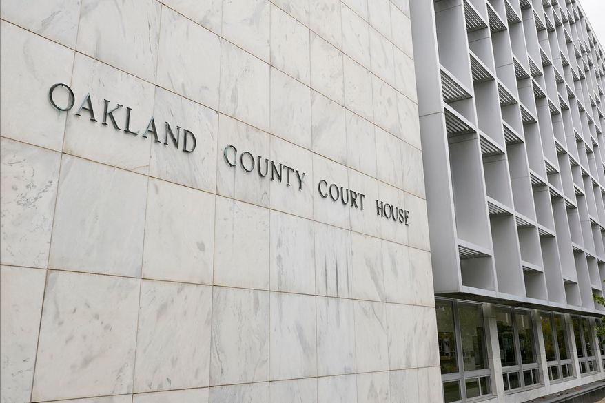 FILE - An Oakland County Courthouse building is shown in Pontiac, Mich., Oct. 19, 2020. (AP Photo/Paul Sancya, File)