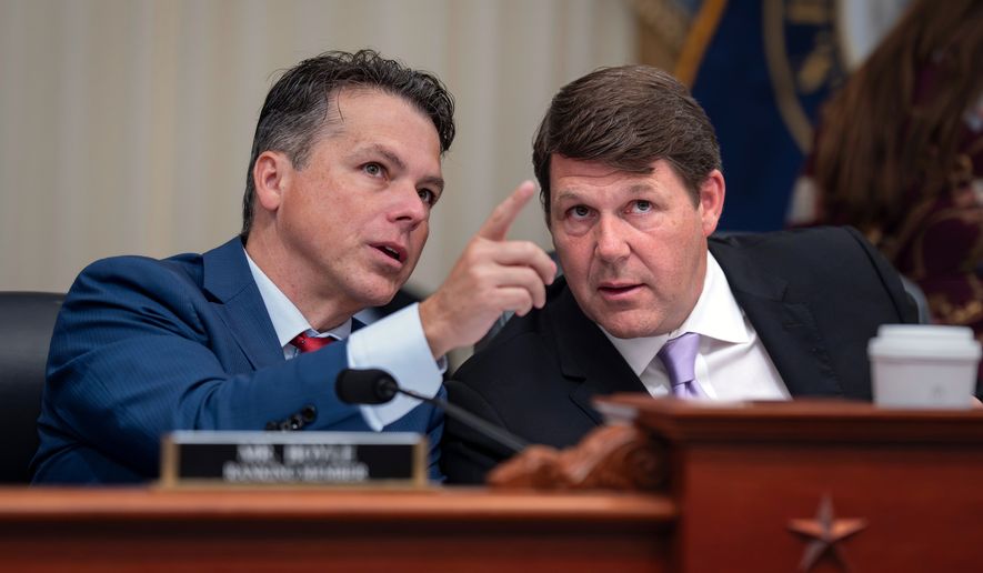 House Budget Committee Chairman Jodey Arrington, R-Texas, right, speaks with Rep. Brendan Boyle, D-Pa., the ranking member, during a markup on the Fiscal Year 2027 spending plan, at the Capitol in Washington, Thursday, July 16, 2026. (AP Photo/J. Scott Applewhite)