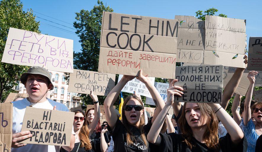 Ukrainians gather to denounce President Volodymyr Zelenskyy's decision to dismiss Defense Minister Mykhailo Fedorov after six months in the post, Kyiv, Ukraine, Thursday, July 16, 2026. (AP Photo/Danylo Antoniuk)