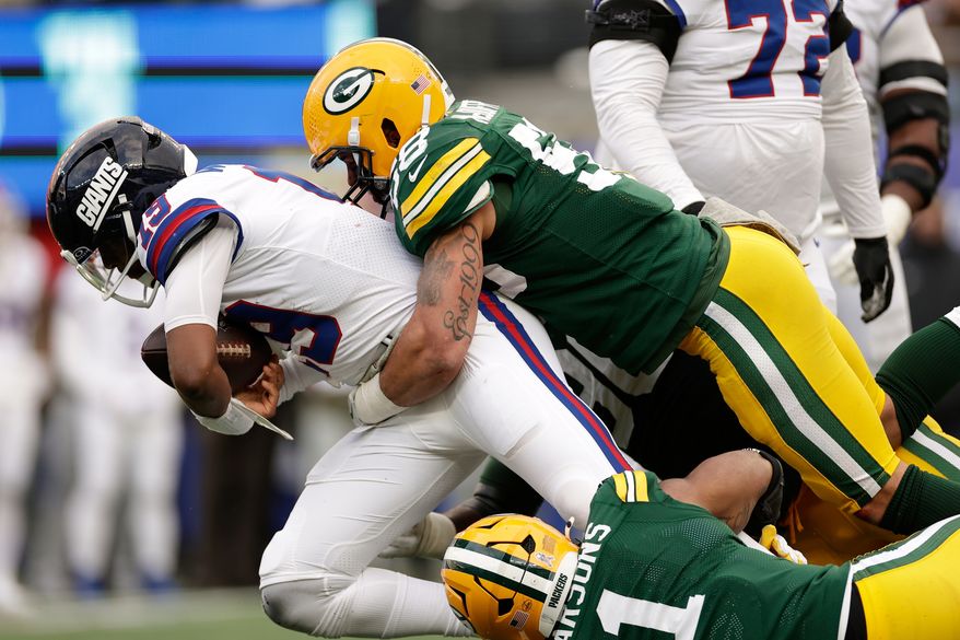 FILE - Green Bay Packers' Micah Parsons and Isaiah McDuffie sack New York Giants' Jameis Winston during the second half of an NFL football game, Nov. 16, 2025, in East Rutherford, N.J. (AP Photo/Adam Hunger, File)