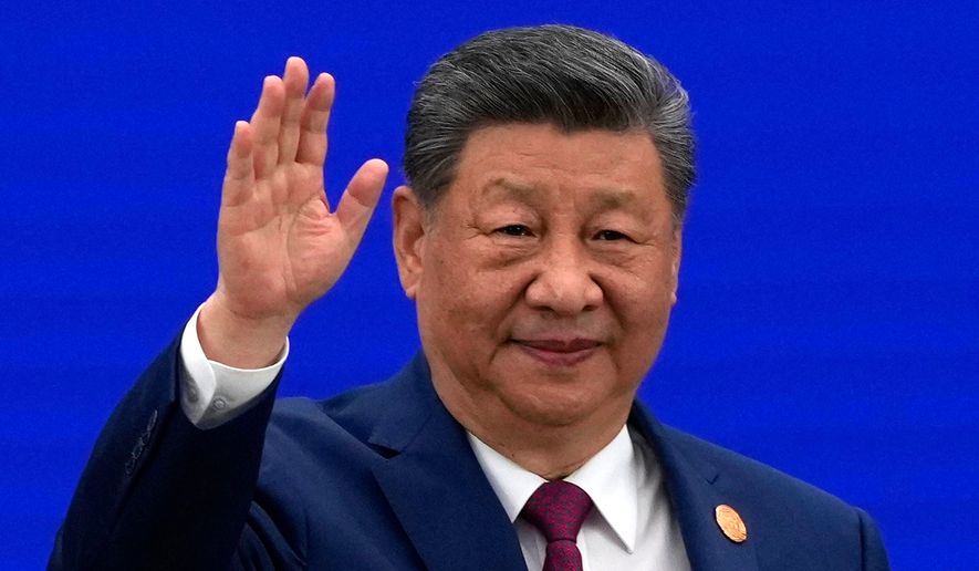 Chinese President Xi Jinping waves as he arrives at the opening ceremony for the World AI Conference in Shanghai, Friday, July 17, 2026. (AP Photo/Ng Han Guan, Pool) ** FILE **