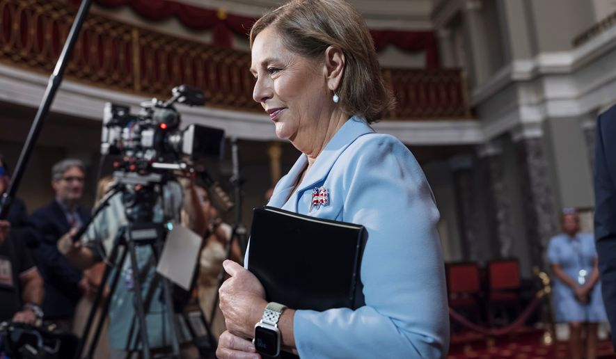 Newly-sworn Sen. Darline Graham, R-S.C., sister of Lindsey Graham, walks past cameras as she leaves the Old Senate Chamber following a cermonial oath of office ceremony allowing her to serve as her late brother's temporary replacement, at the Capitol in Washington, Tuesday, July 14, 2026, (AP Photo/J. Scott Applewhite)